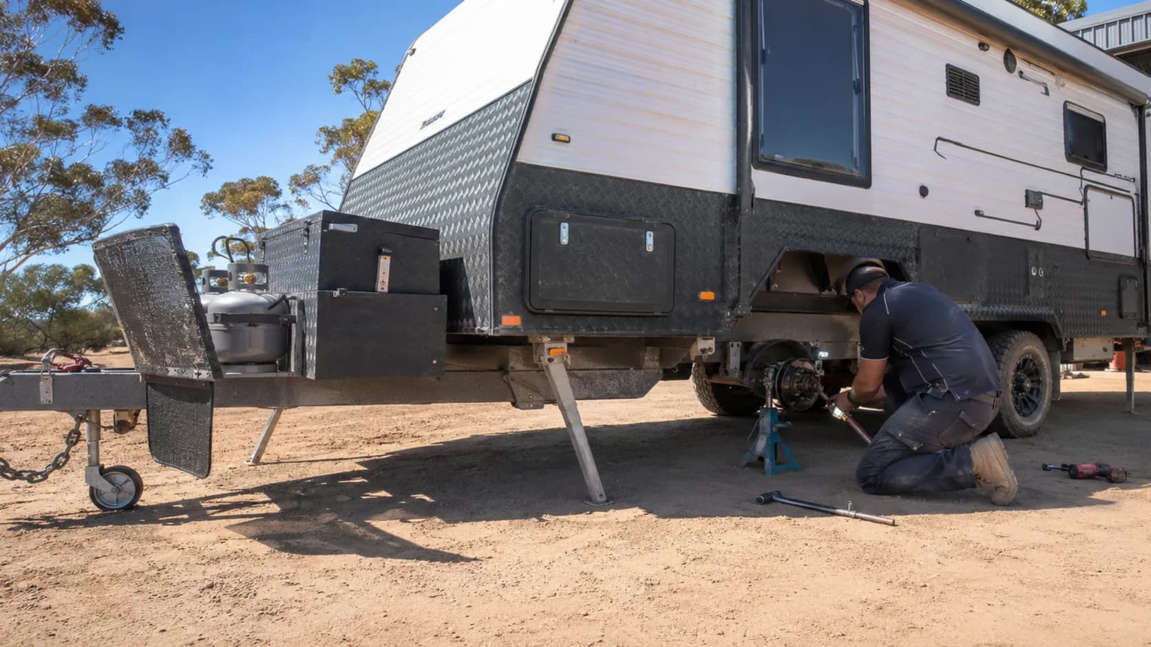 A caravan up on stands in a service workshop in Australia