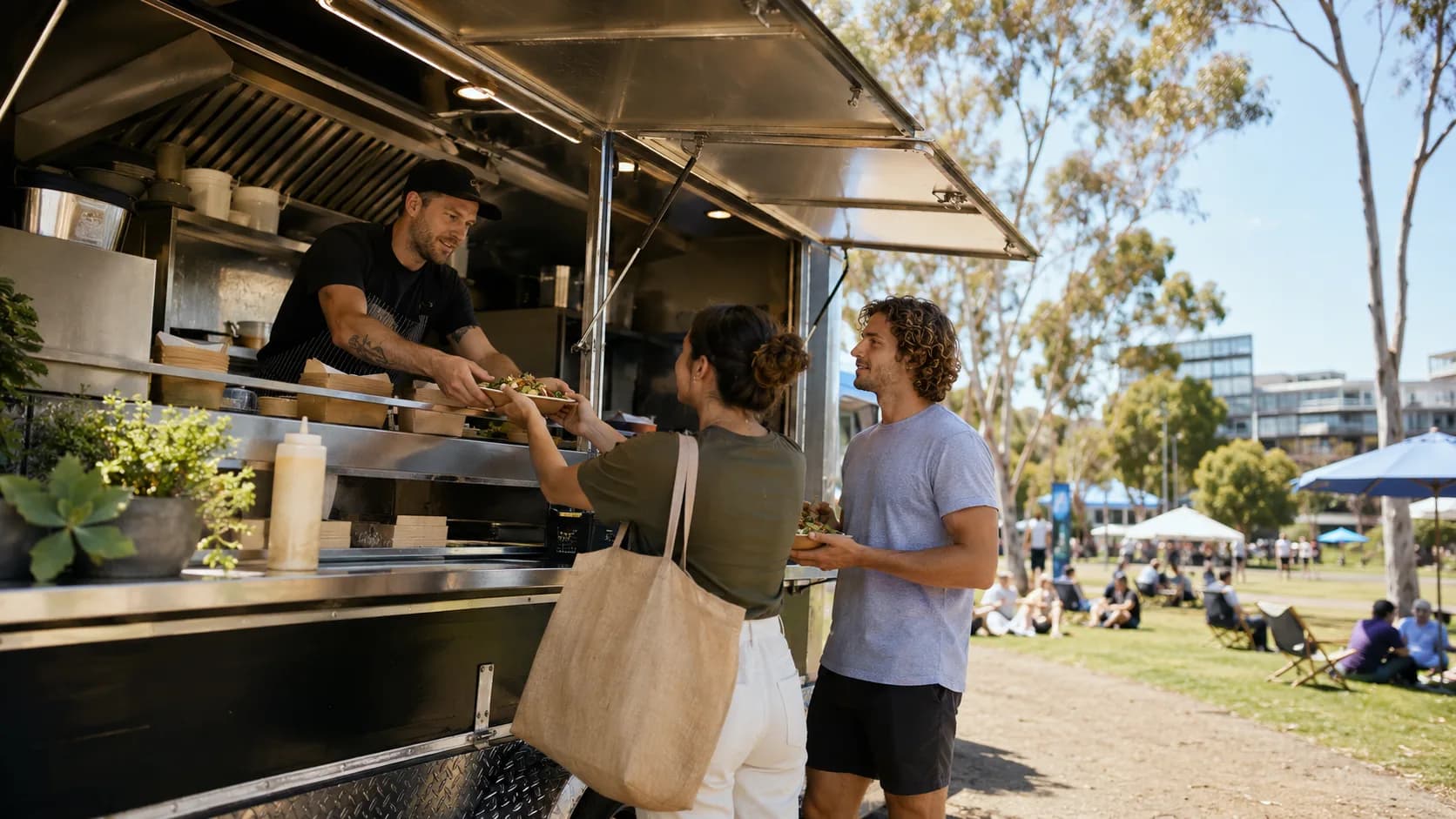 food truck serving lunch at a sunny park event in Australia