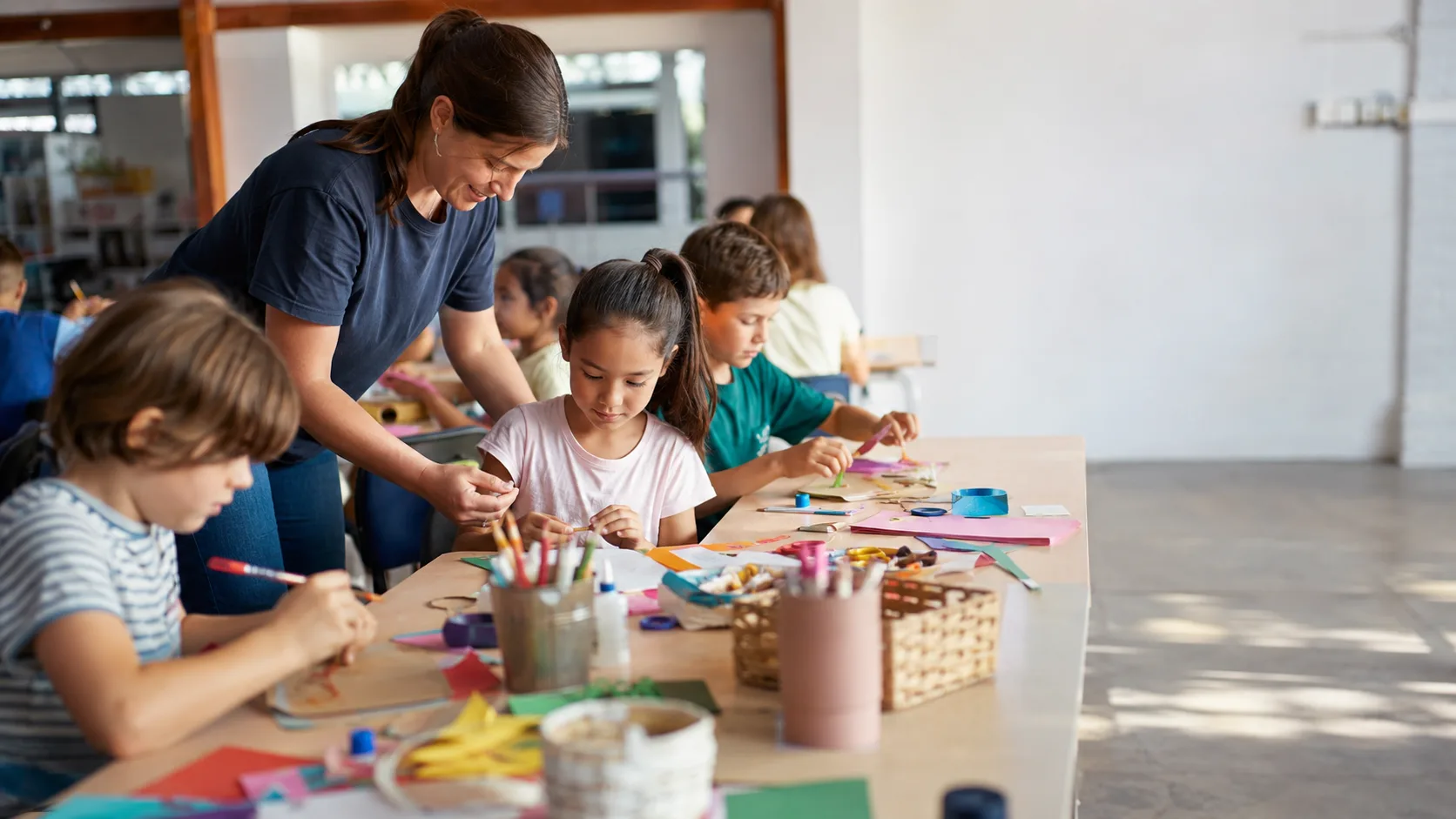 Children completing a supervised craft activity at an Australian holiday program