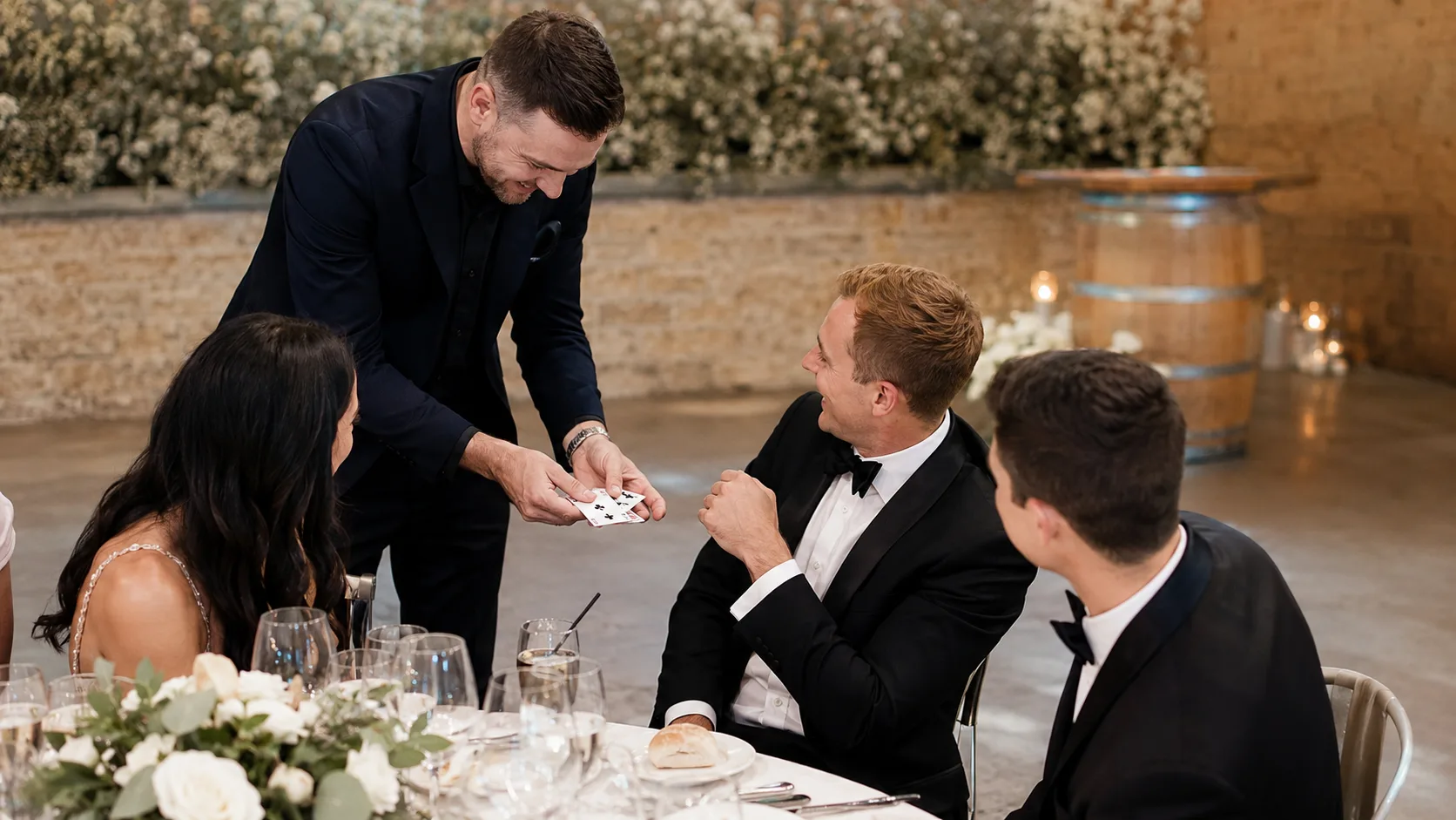 Magician performing close-up magic for delighted event guests in Australia