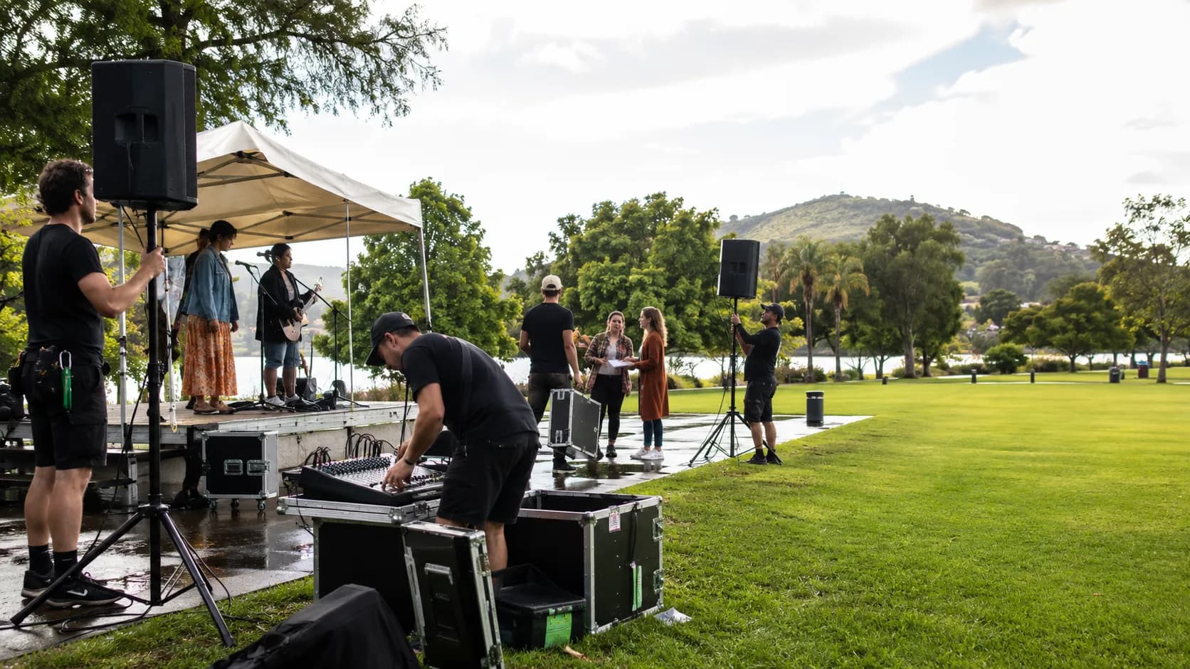 Customers collect booked speaker, mixer or microphone kit from an active Australian hire business