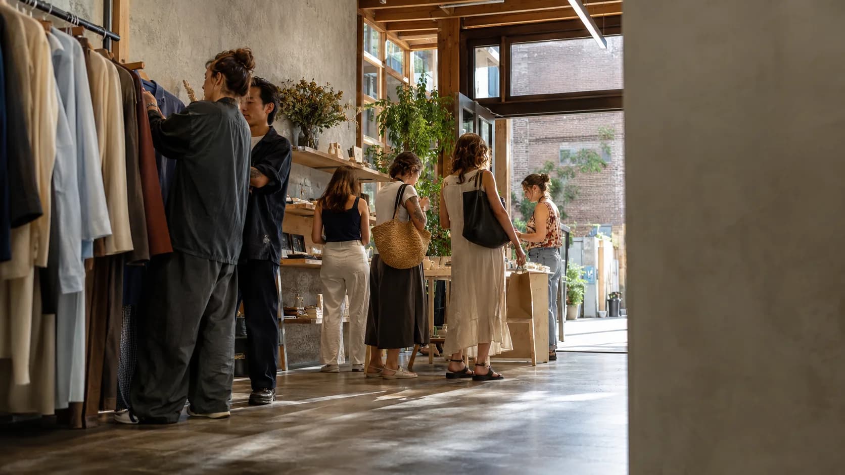 Staff prepare an active pop-up shop as customers begin arriving