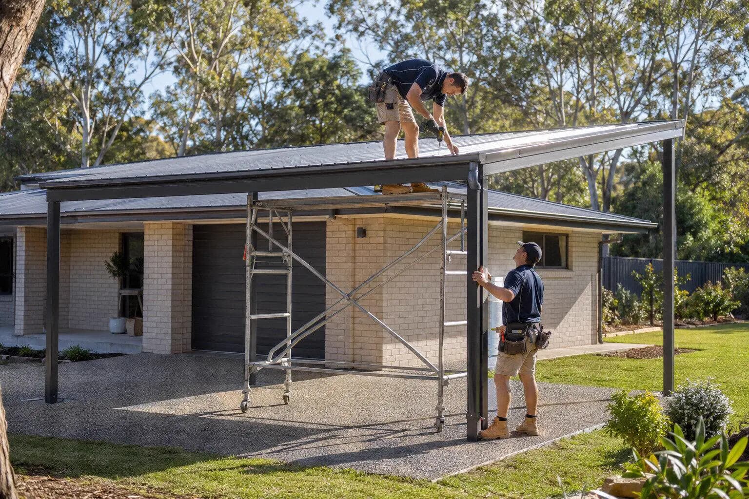 A crew standing a steel shed frame on a poured pad in Australia