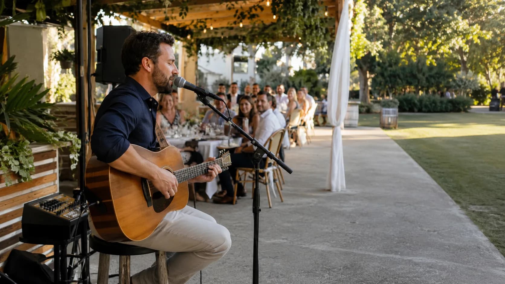 Solo musician performing live music for guests at an event in Australia