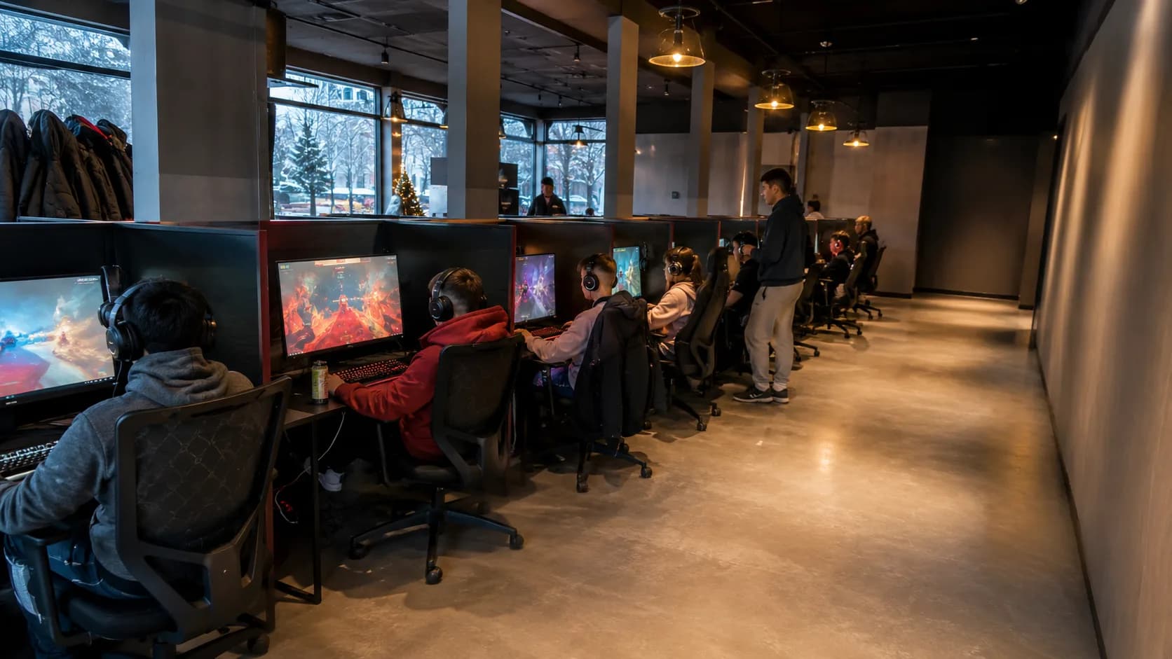 Players fill a bright Canadian gaming lounge during winter evenings