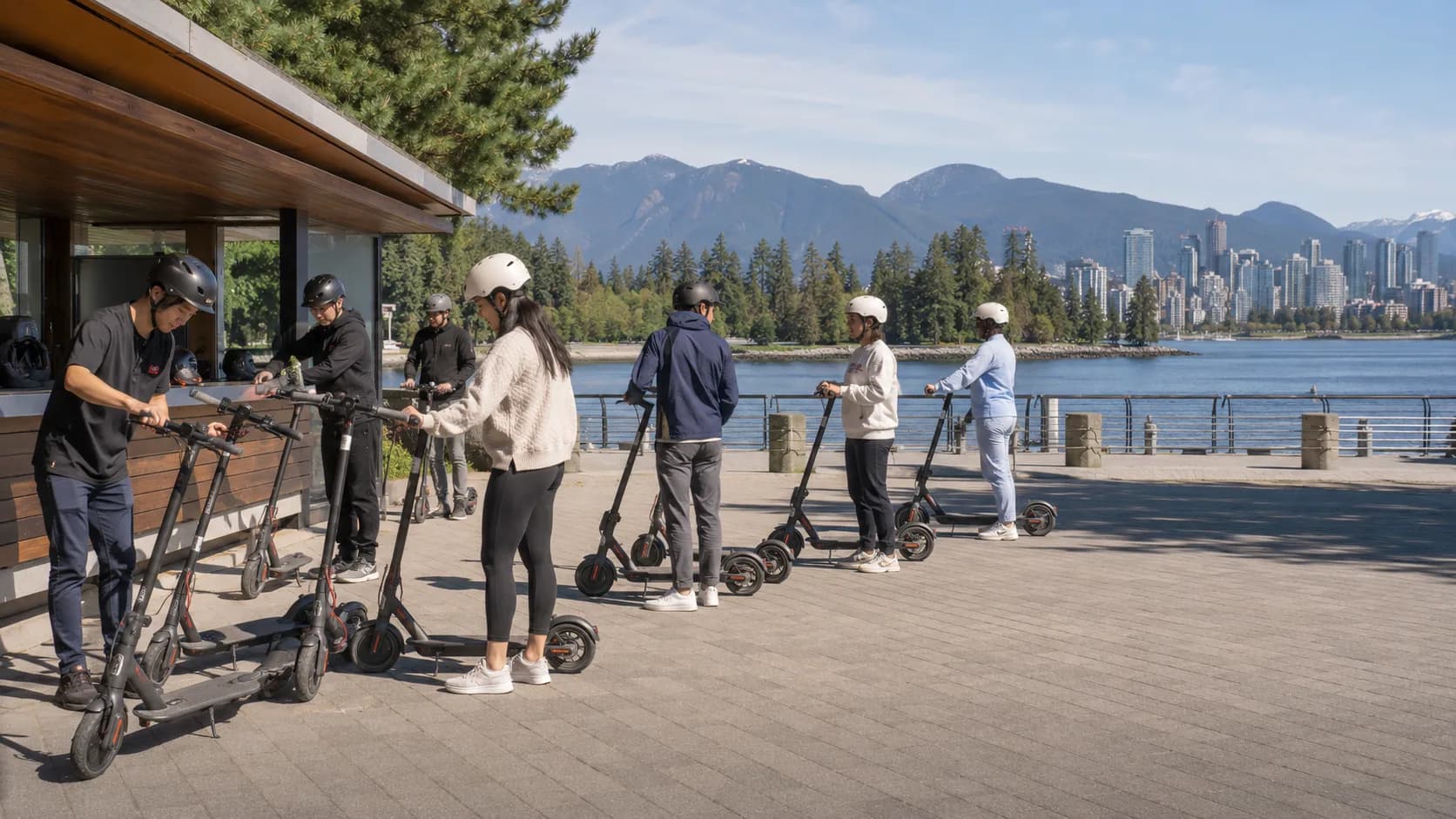 Customers pick up reserved scooter model from an active business in Canada