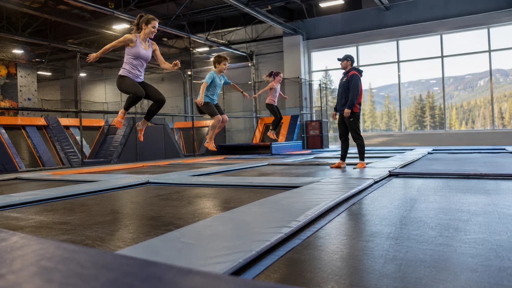 Kids bounce across an indoor trampoline park court in Canada in winter