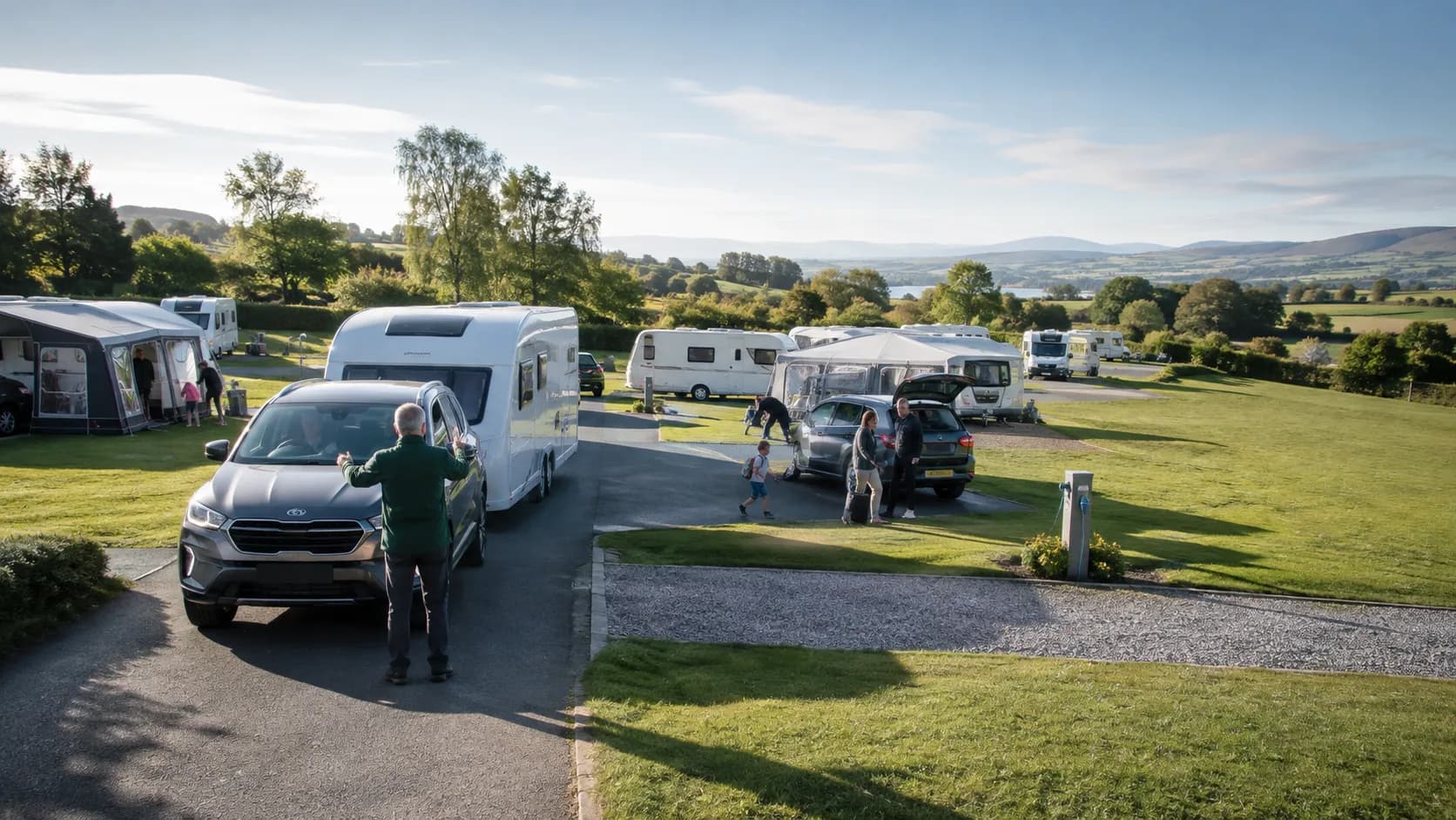 Guests use occupied touring pitch in the UK beneath directional light