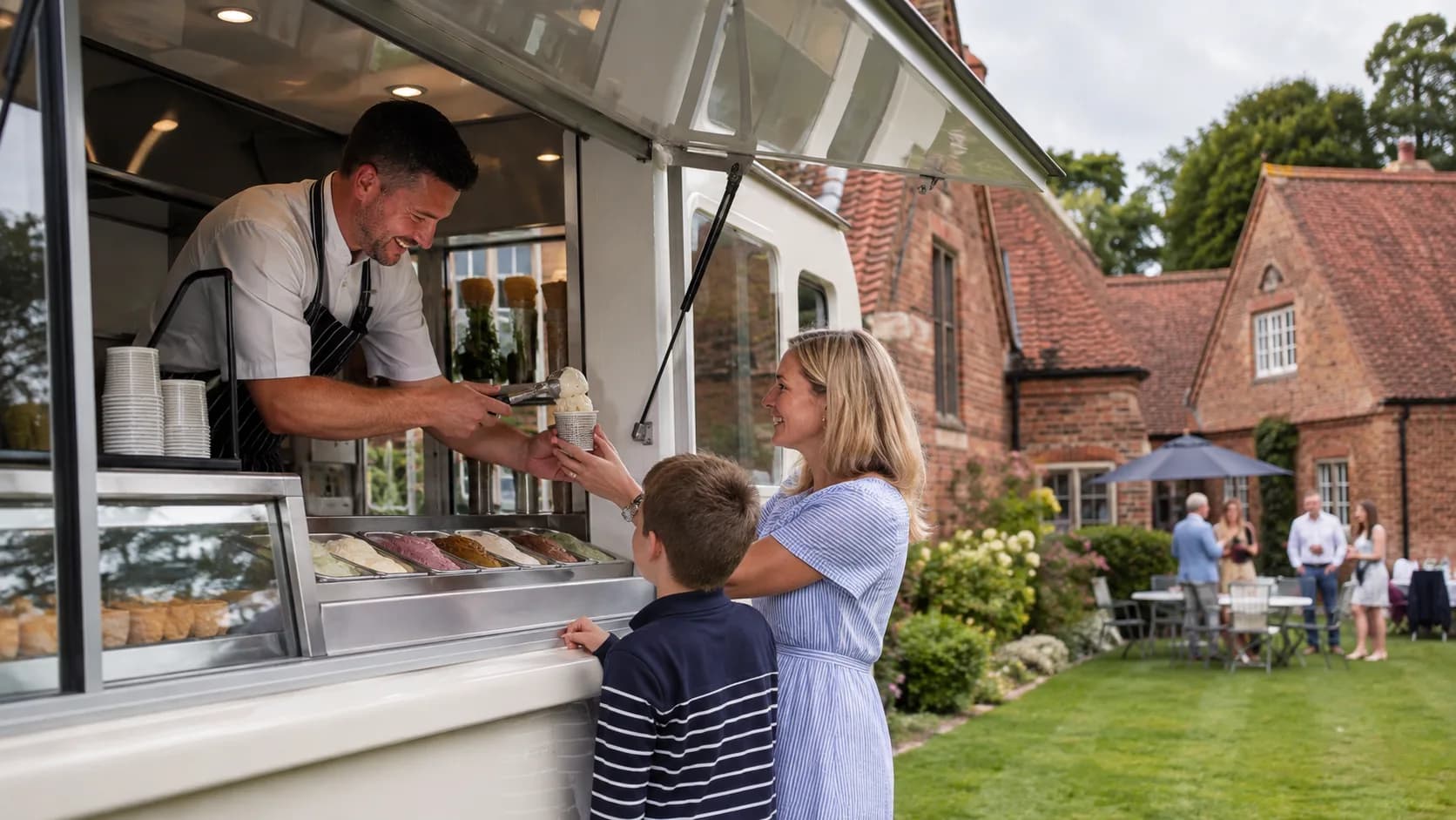 the UK ice-cream van serving a garden party beside brick homes