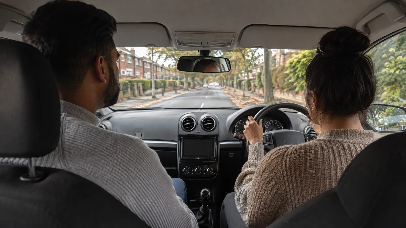 A driving instructor and learner on a lesson in the UK