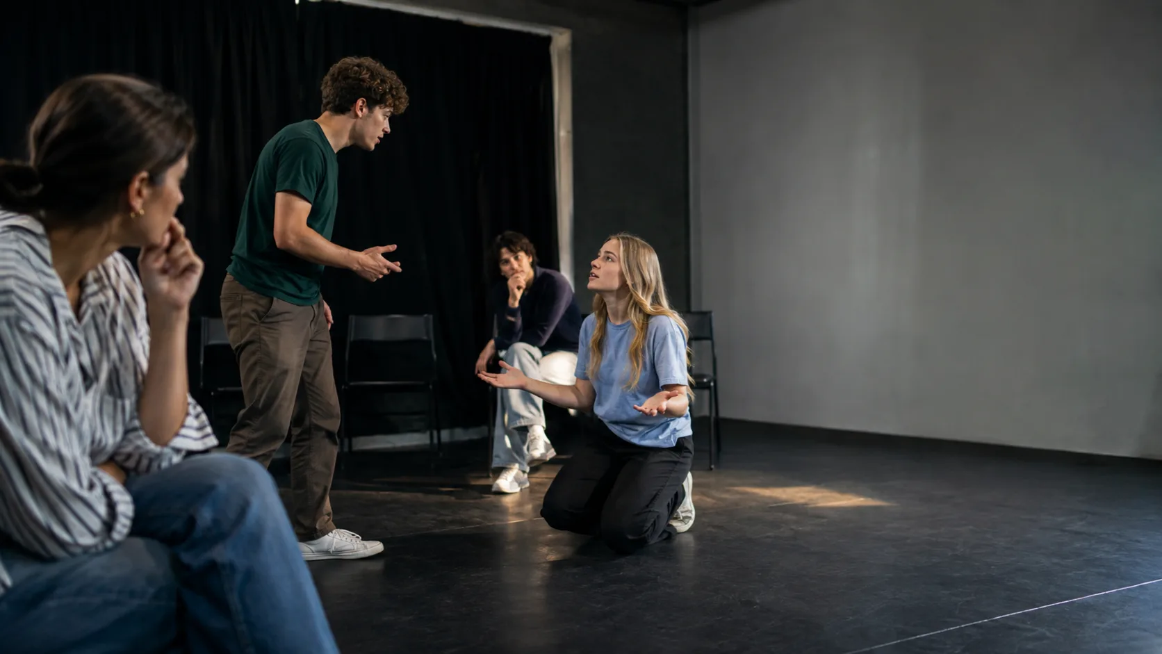 Improv students performing a scene in a fringe studio in the UK