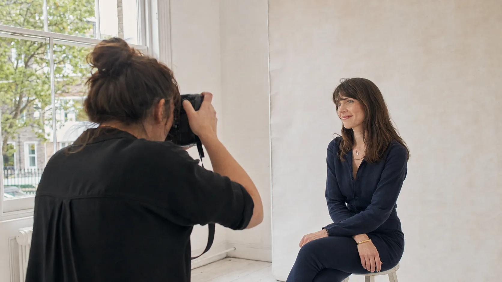 A portrait photographer working with a family in the UK