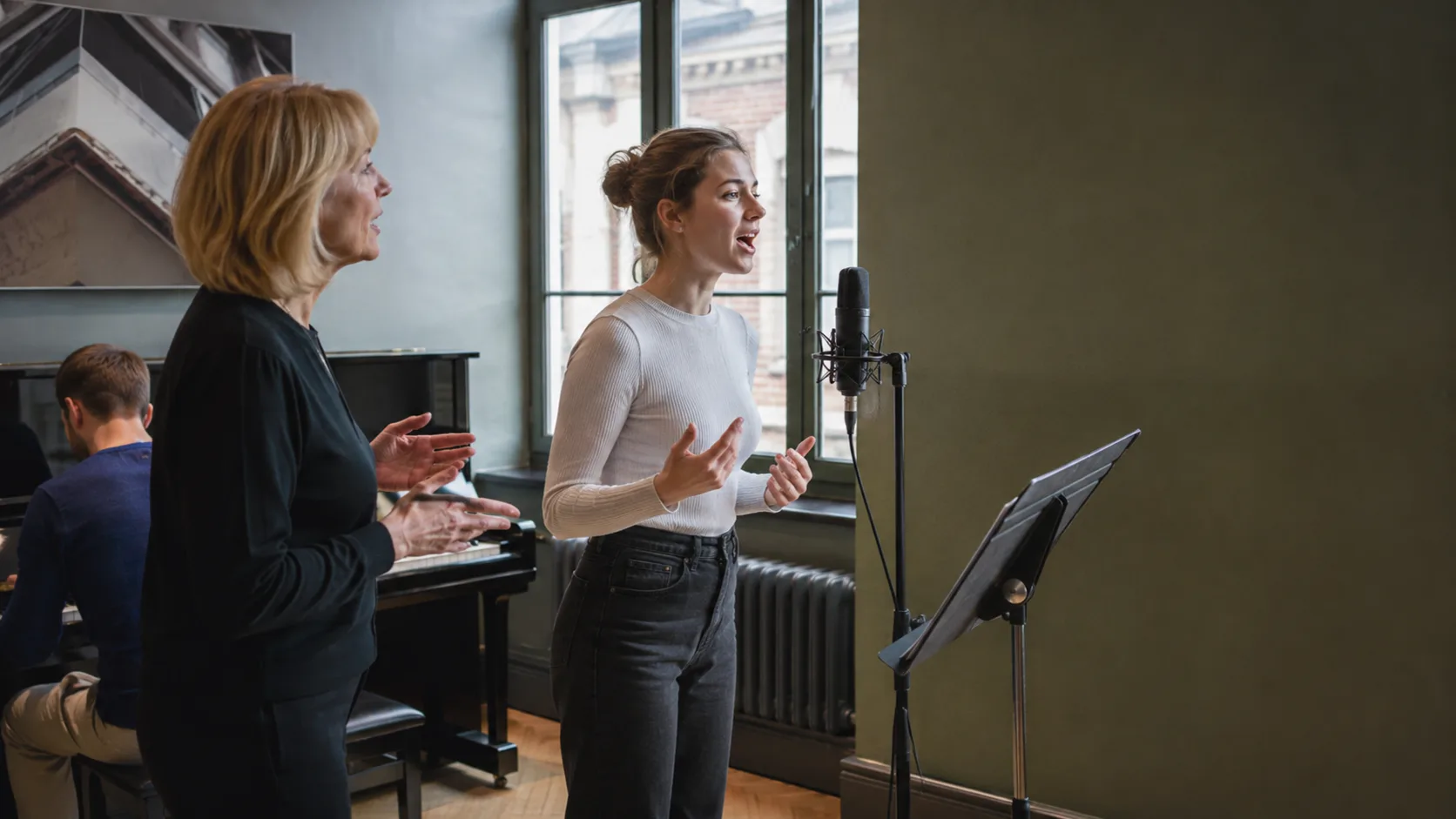 Singing teacher leading a lesson in a compact studio in the UK