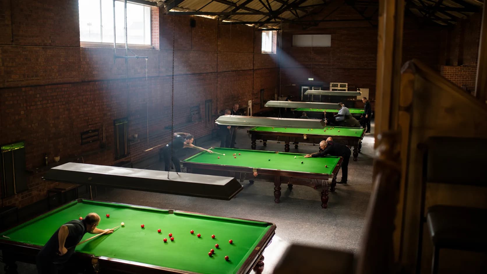 League players use full-size tables inside a brick club in the UK