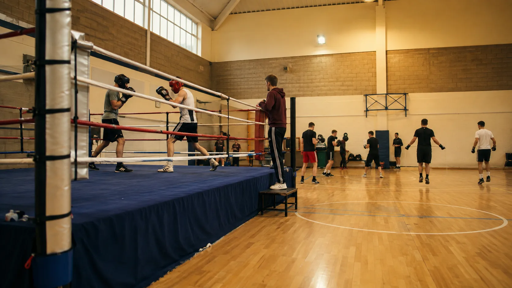 Athletes spar inside a bright community boxing gym in Ireland