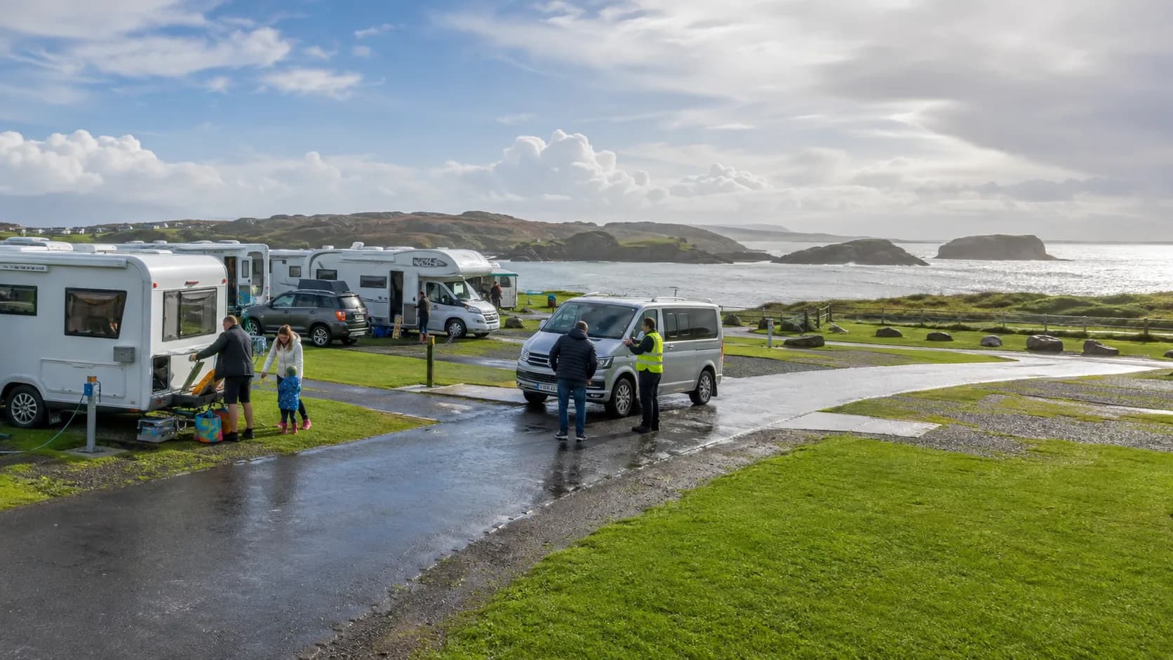 Guests arrive at occupied touring pitch in Ireland in bright natural light
