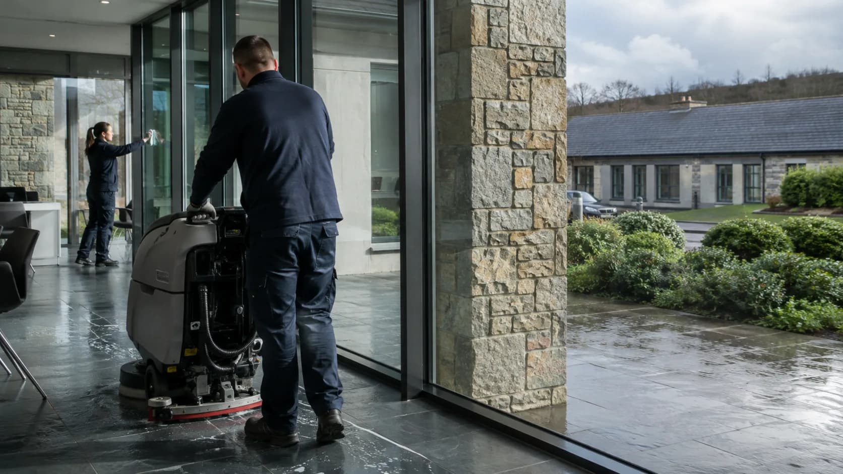 A commercial cleaner working through an office after hours in Ireland