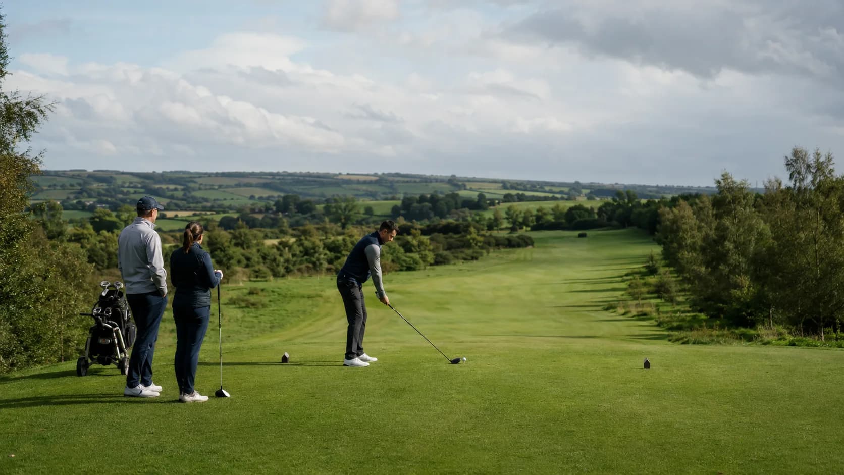 An Irish links course in morning light, the fairway running toward the green