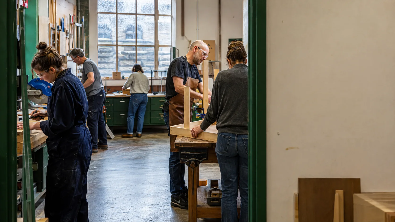 Makers share tools across a busy Irish community workshop tonight
