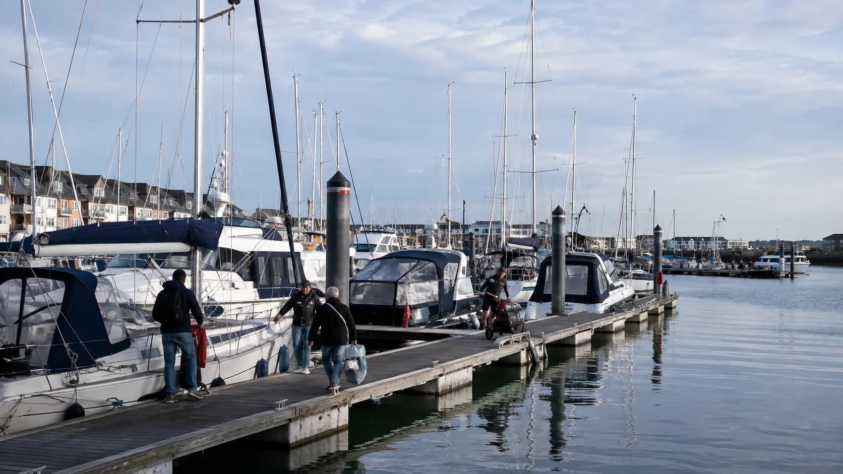 Guests arrive at occupied berth by vessel length in Ireland in bright natural light
