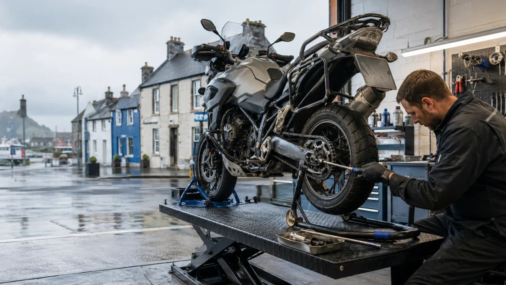 A mechanic working on a motorcycle in a workshop in Ireland