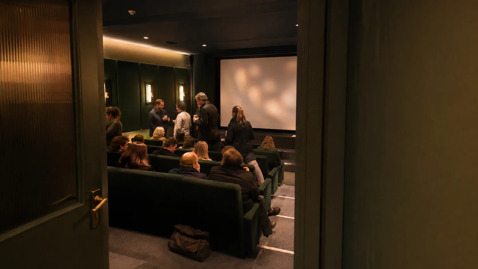 A film group gathers inside an intimate Irish screening room