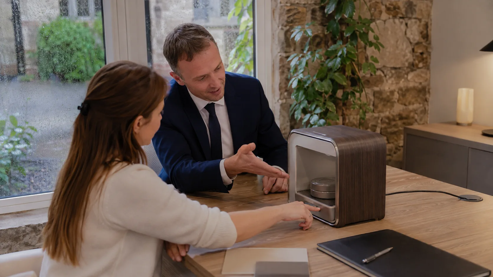 A product specialist demonstrates a device to a customer in Ireland
