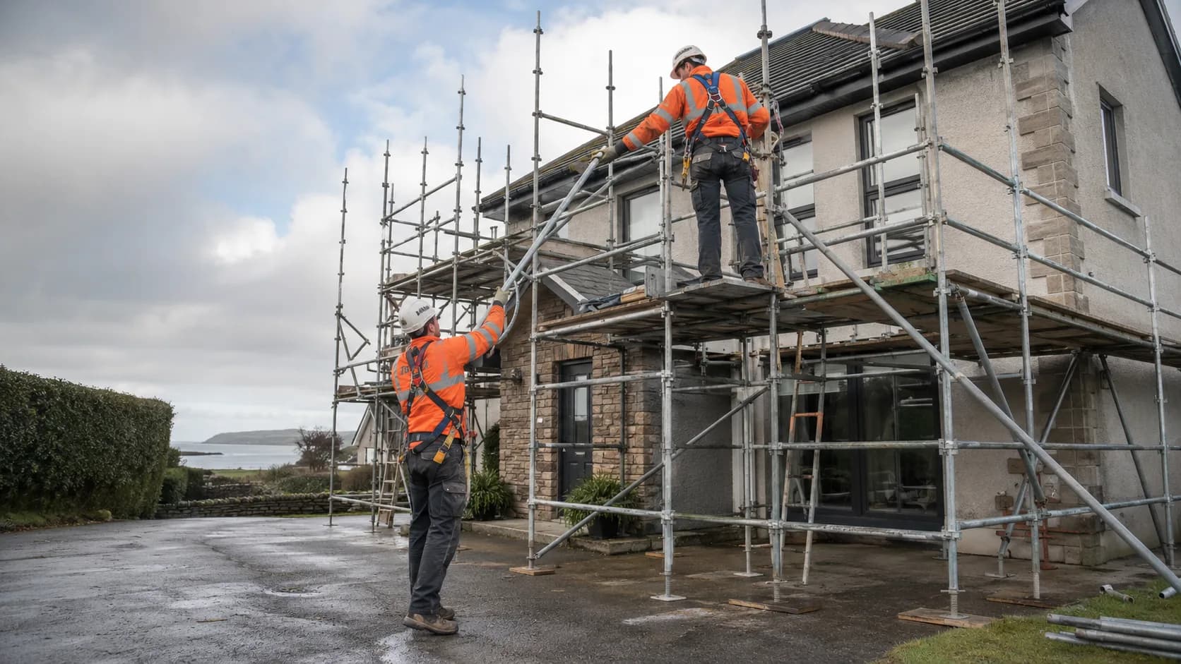 Scaffolders erecting a scaffold on a house in Ireland