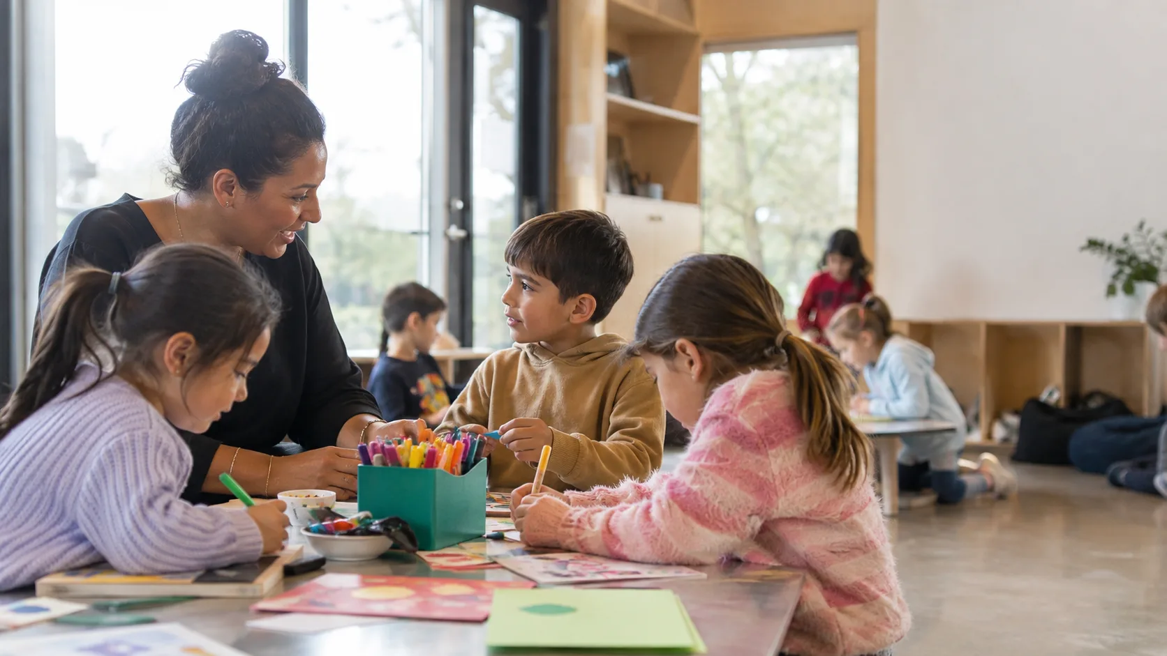 Children completing activities with staff at a New Zealand school care programme