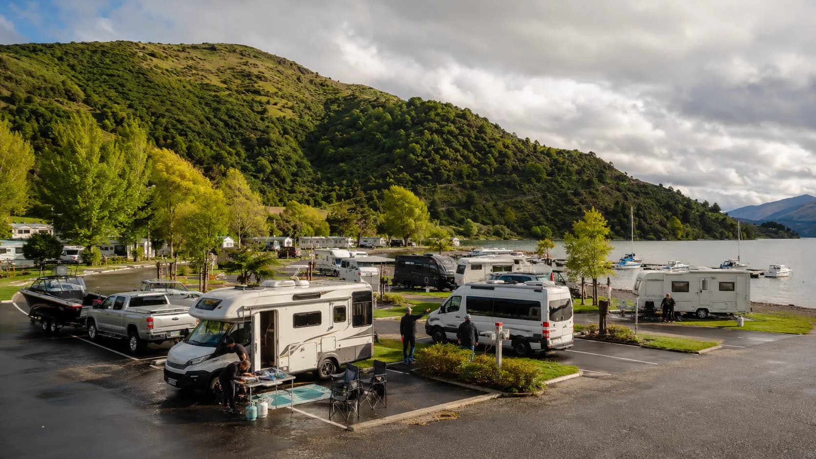 Guests arrive at occupied New Zealand powered or non-powered site beside native scenery
