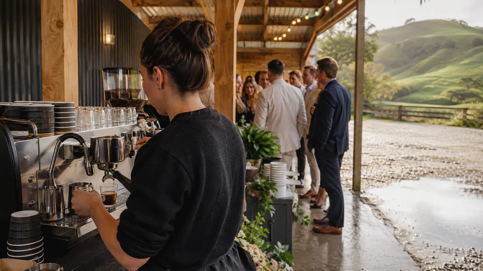 New Zealand coffee cart serving at a rainy timber wedding venue