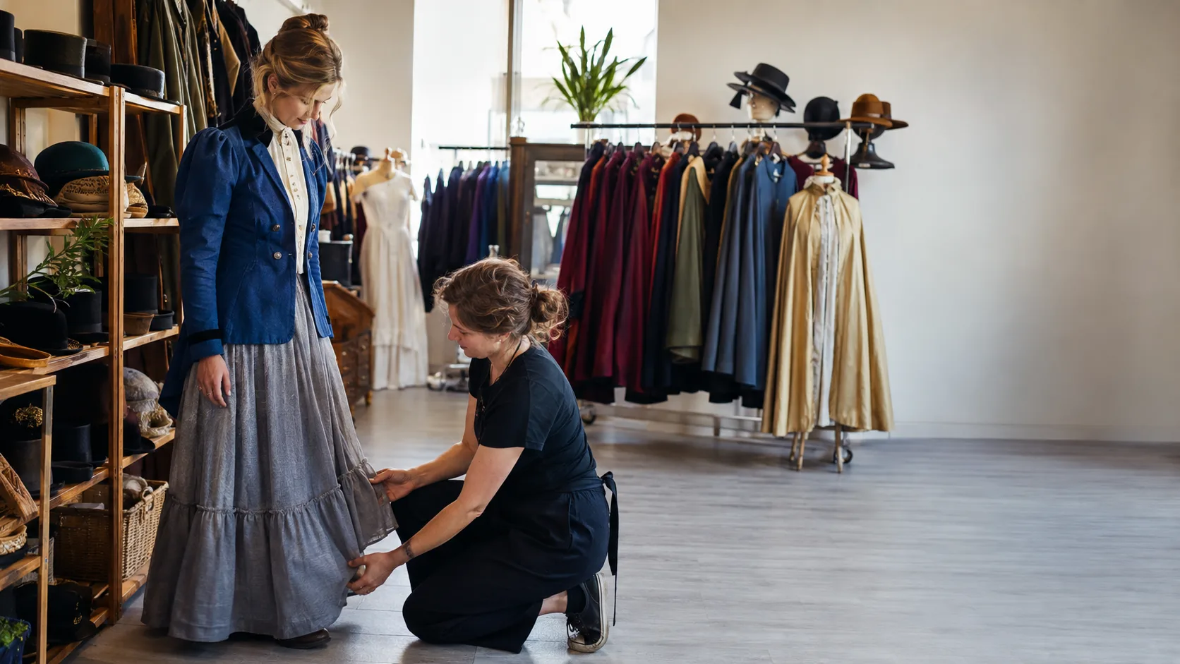 Customer choosing a theatre costume inside a New Zealand shop