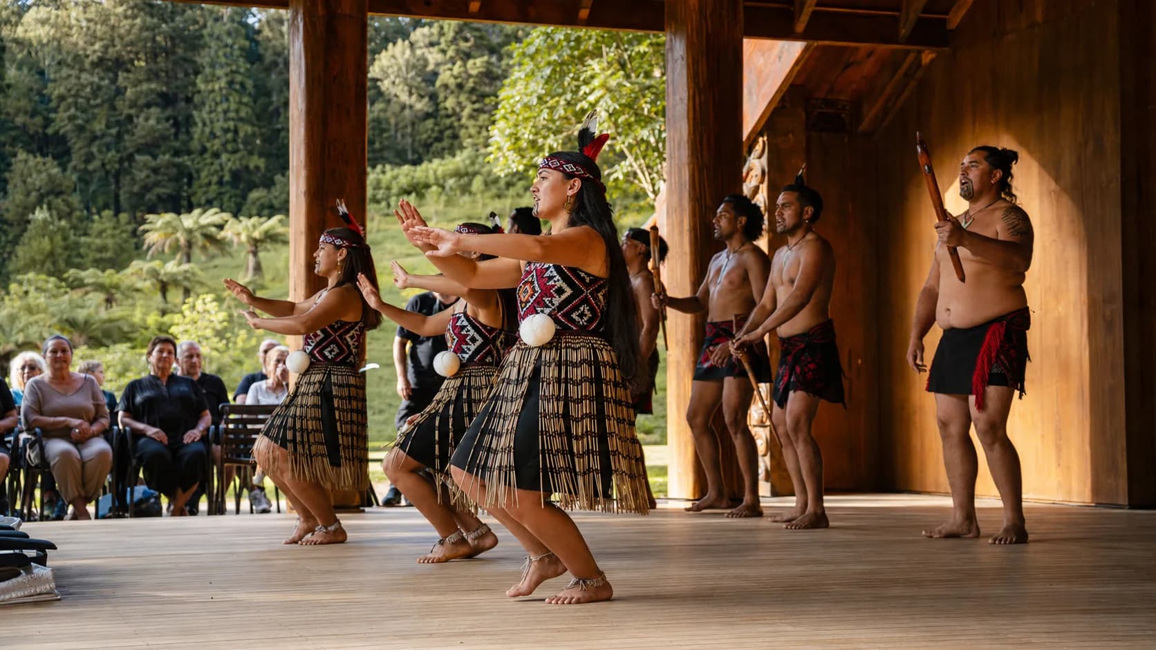 Dance troupe performing for a gathered event audience in New Zealand
