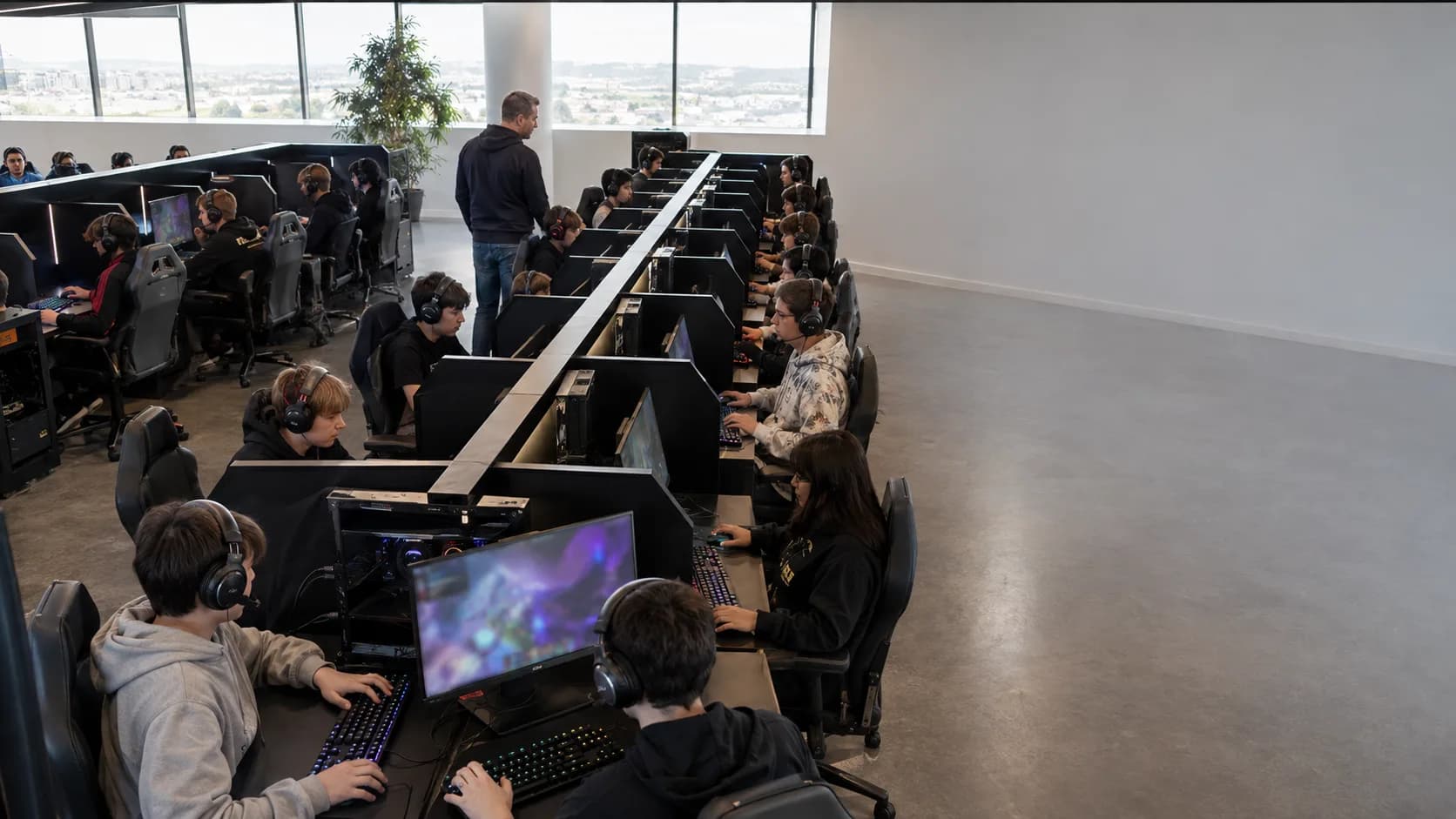 Teams play across a busy timber-lined city gaming lounge tonight