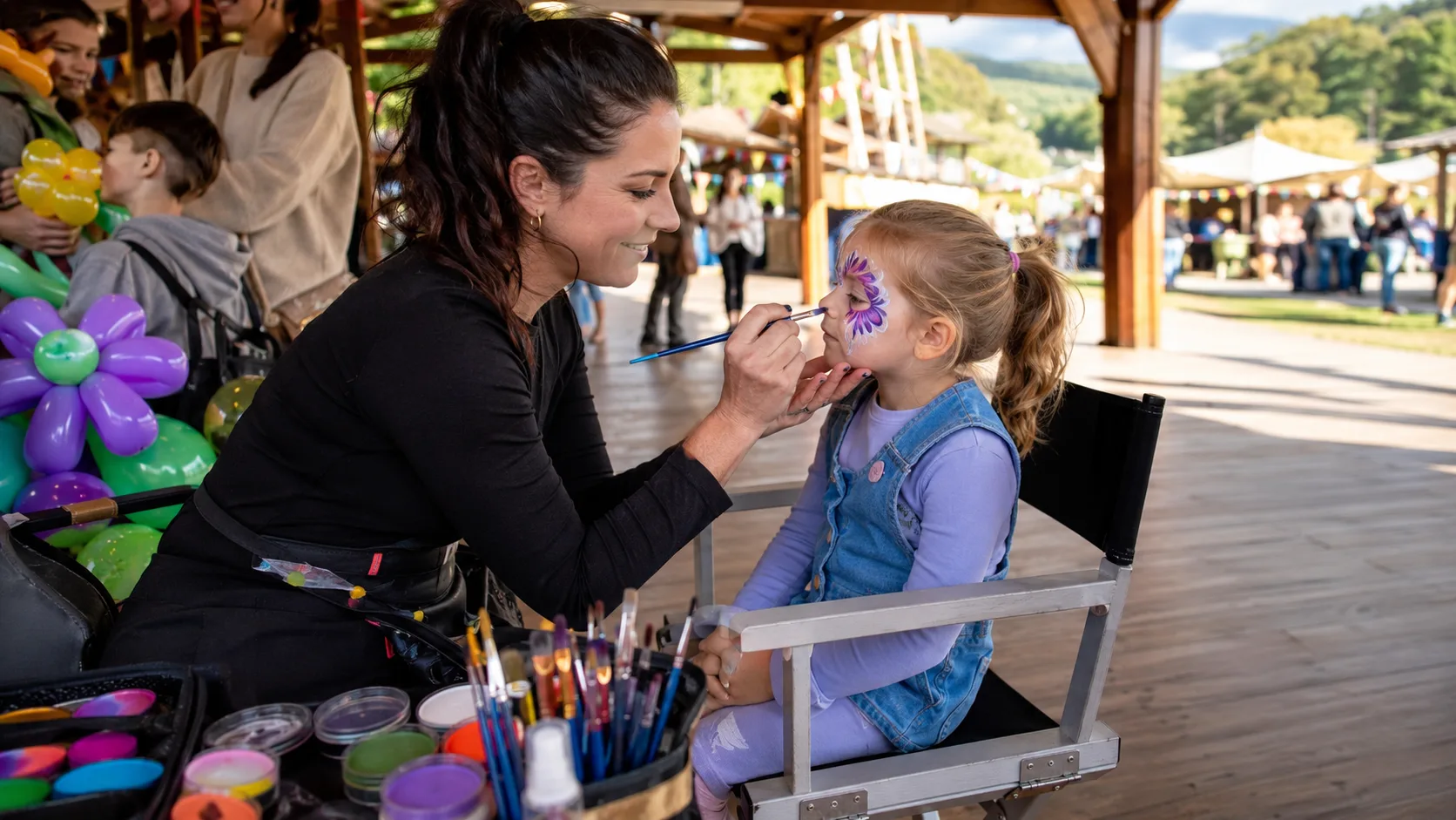 Face painter working at a busy family event in New Zealand