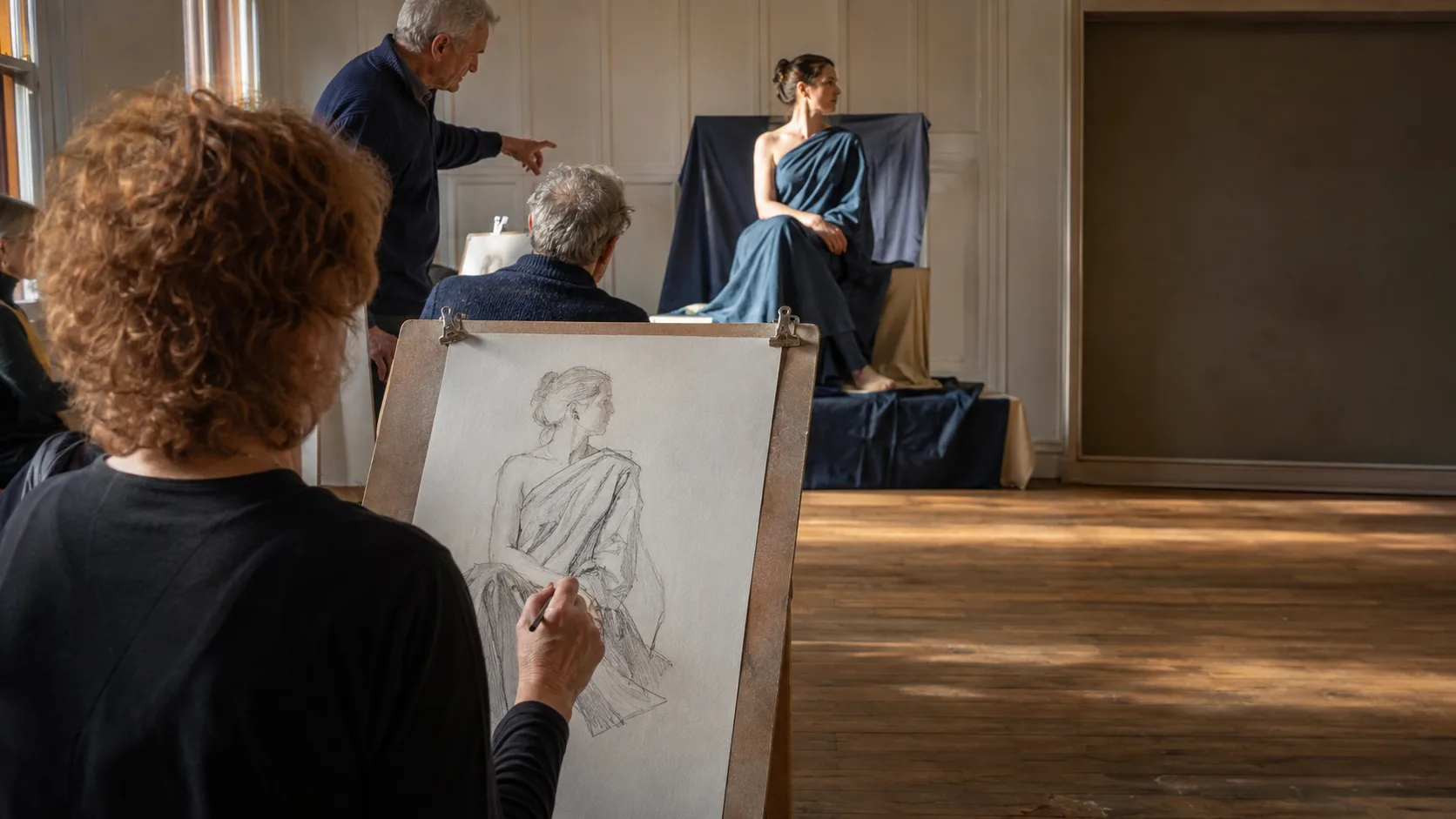 Students drawing a draped figure in a New Zealand arts room