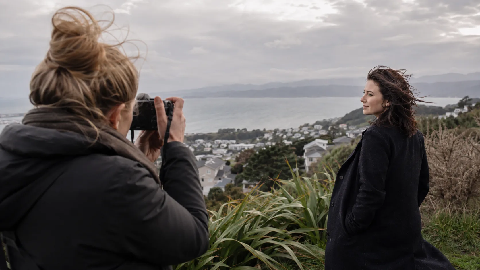 A portrait photographer working with a family in New Zealand