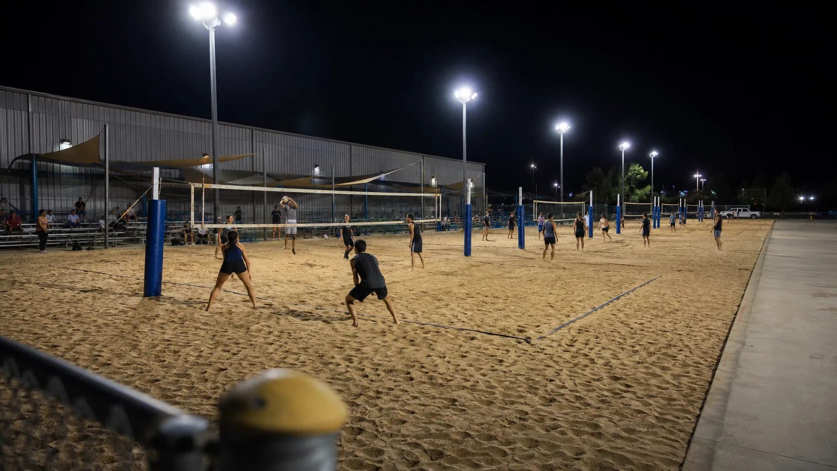Groups rally across commercial beach volleyball courts in the US