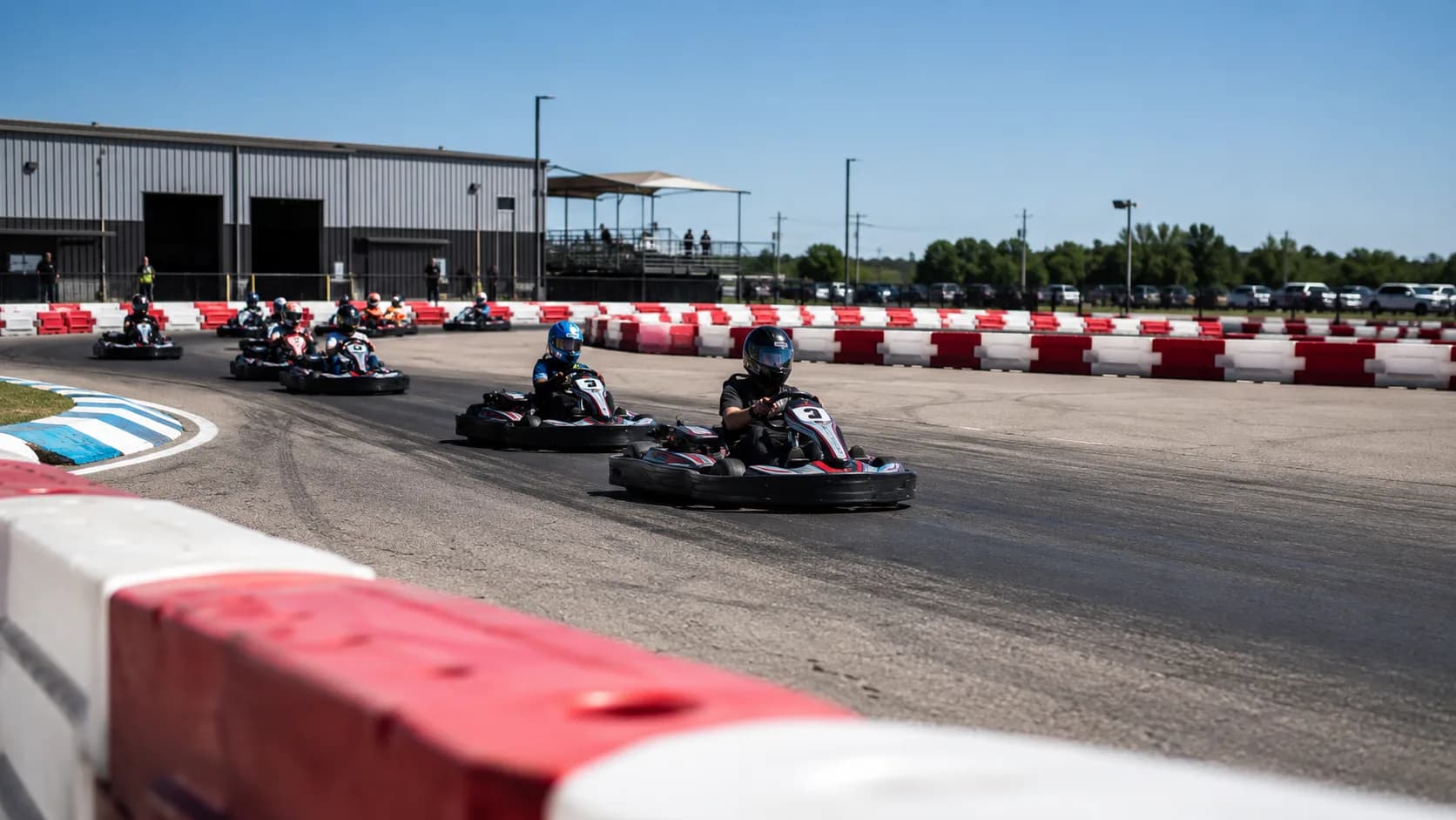Drivers sweep through a busy commercial karting circuit in the US