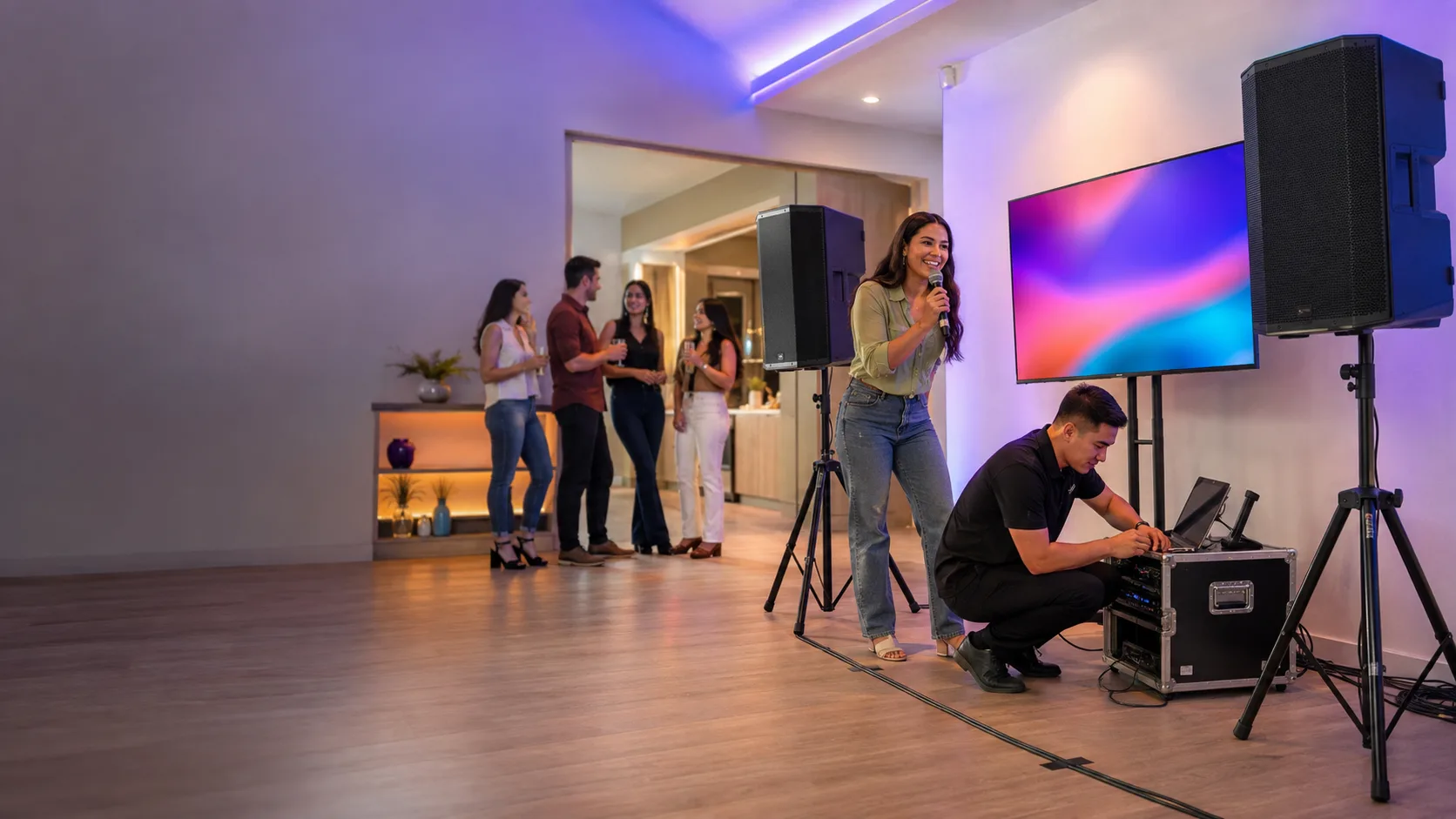 Operator completing a karaoke setup inside a party room in the US