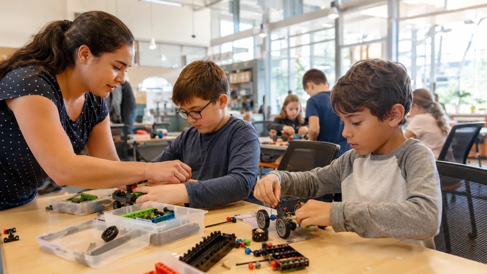 A teacher guides children through a lively hands-on activity class in the US