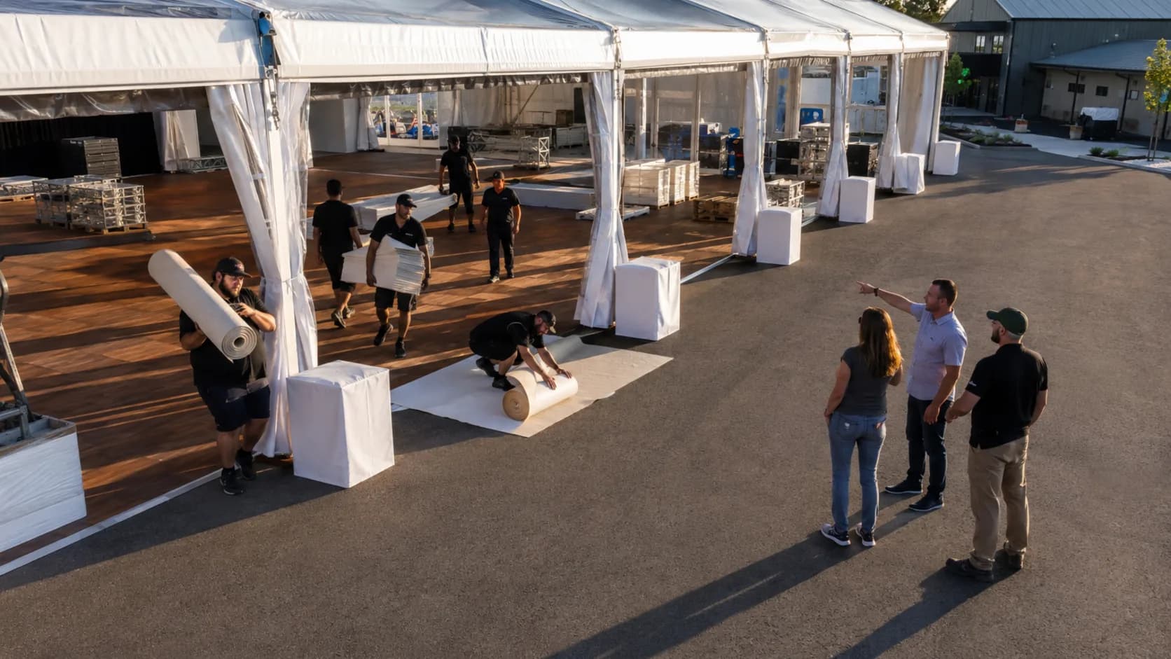 Team reviewing a tent installation at a event venue in the US
