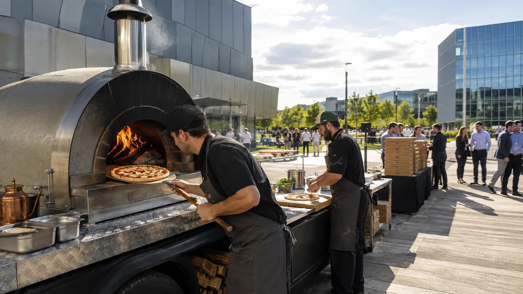 the US pizza catering crew serving from a large oven trailer