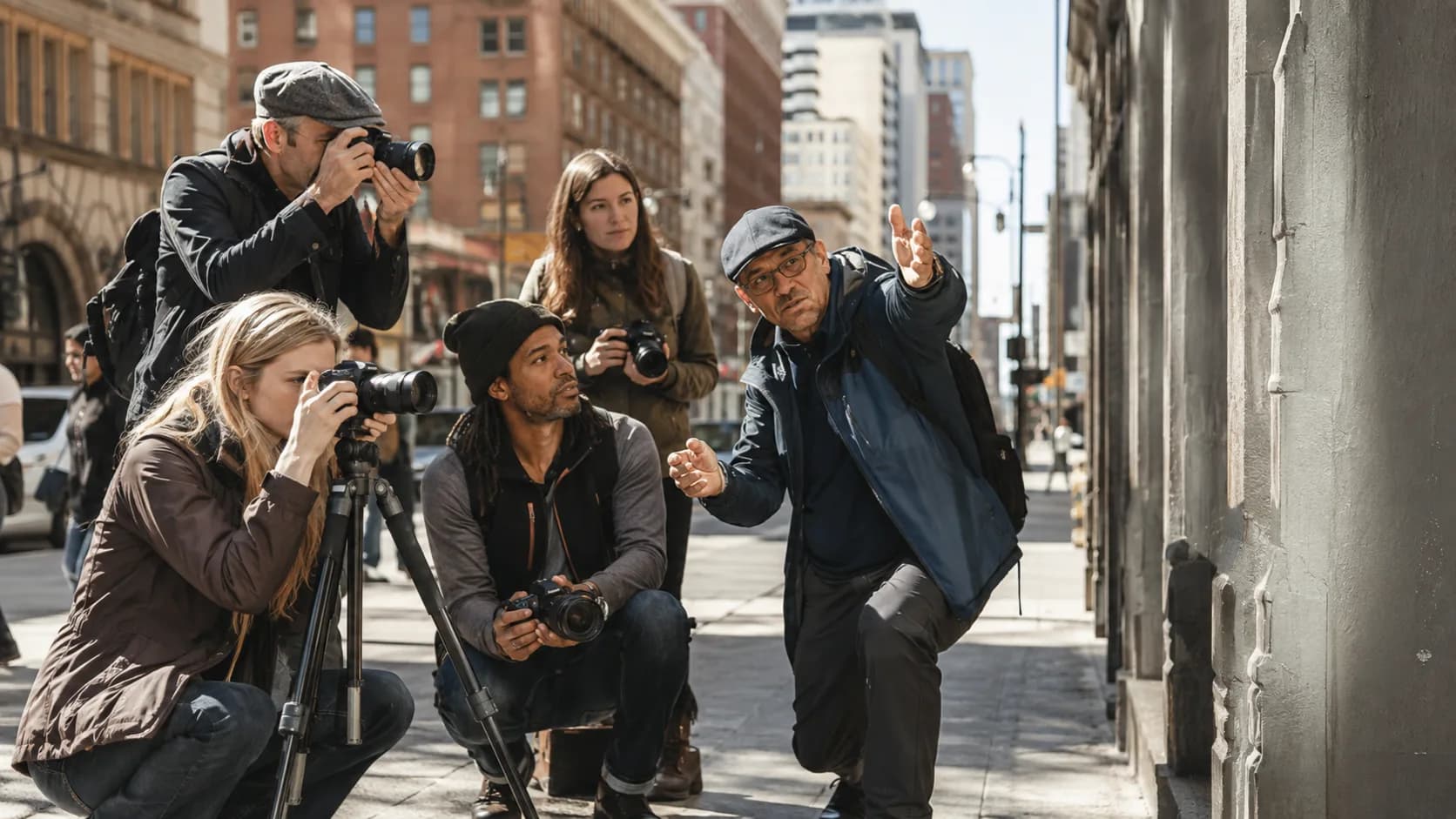 Instructor coaching a downtown photography workshop in the US