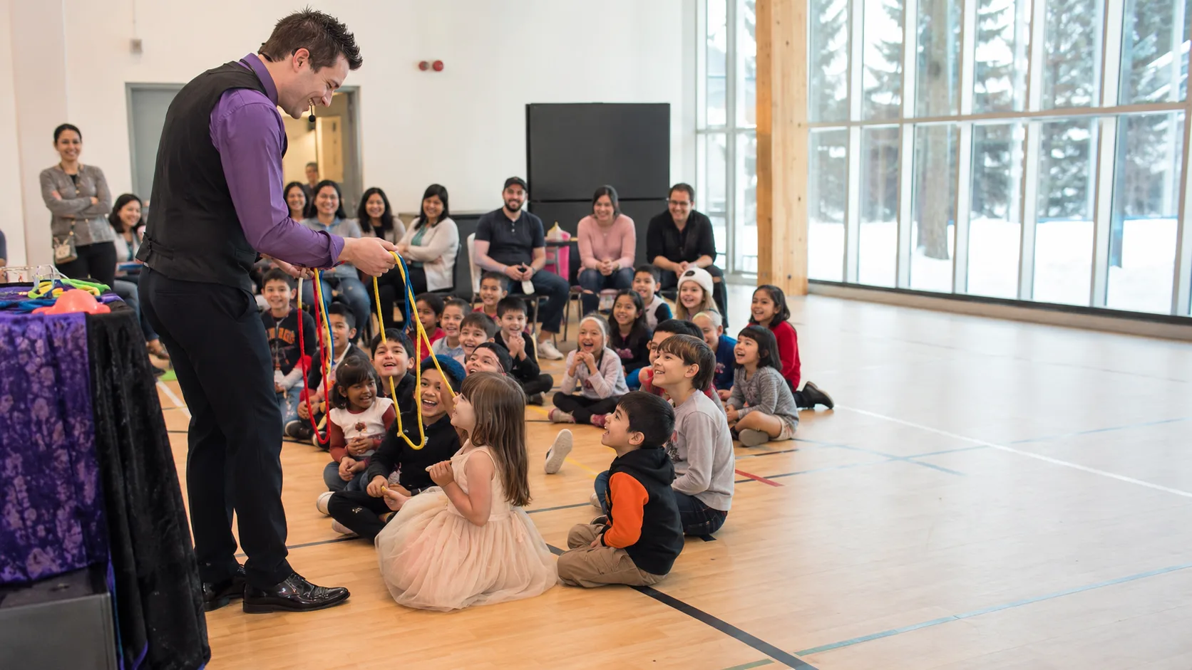 Children’s entertainer leading a cheerful party activity for families in Canada