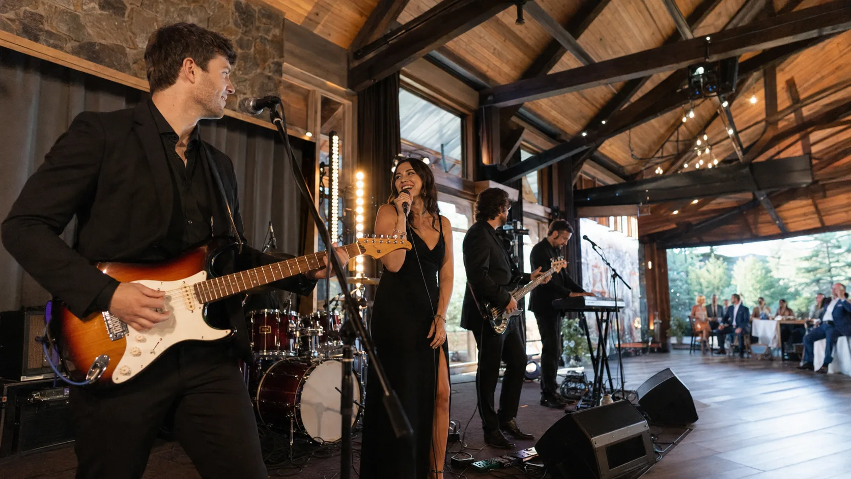 Live band performing for an engaged event crowd in Canada