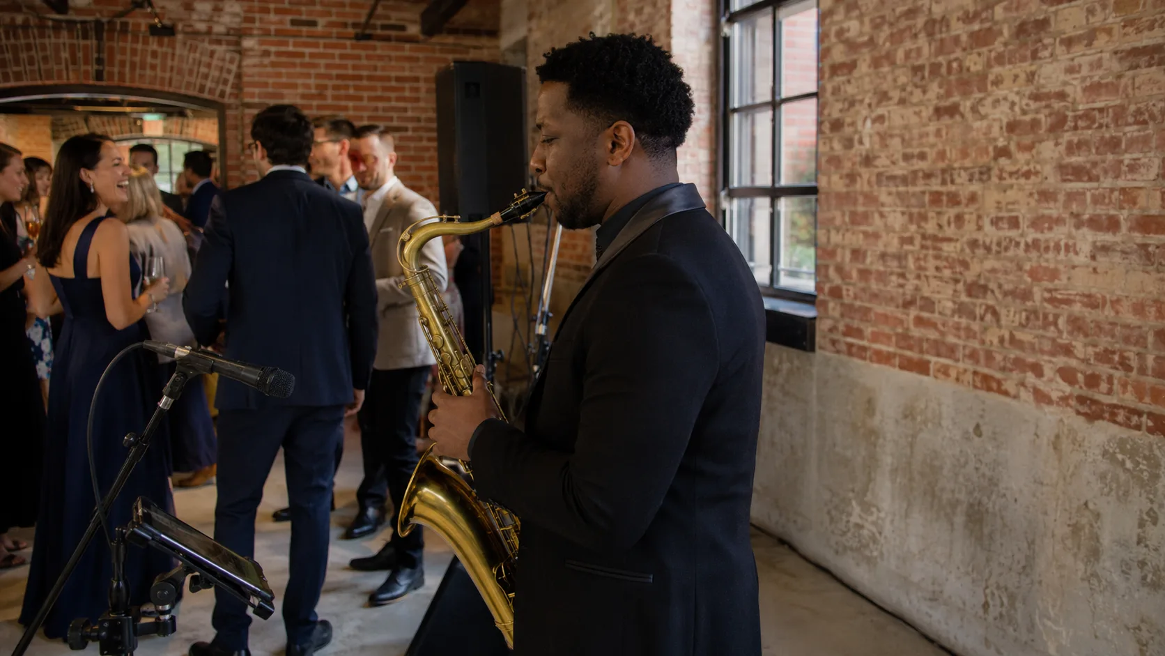 Solo musician performing live music for guests at an event in the UK