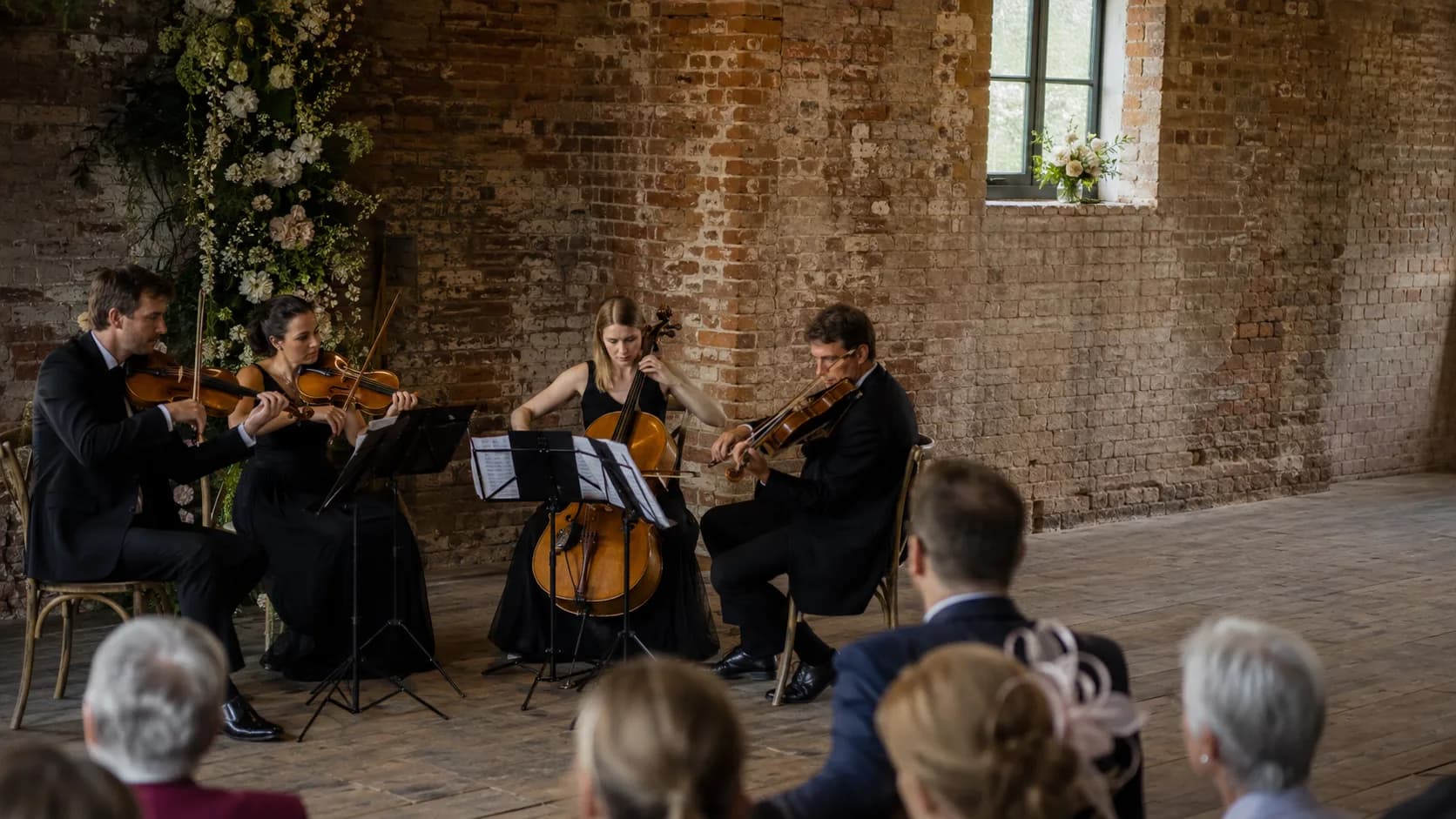 String quartet performing at an elegant booked event in the UK