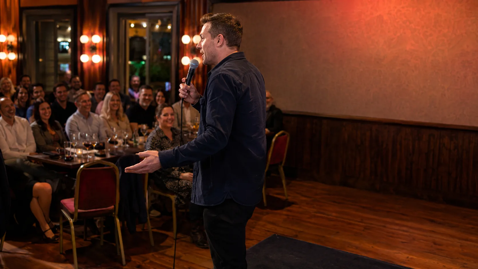Comedian or MC engaging a seated event audience live in Ireland