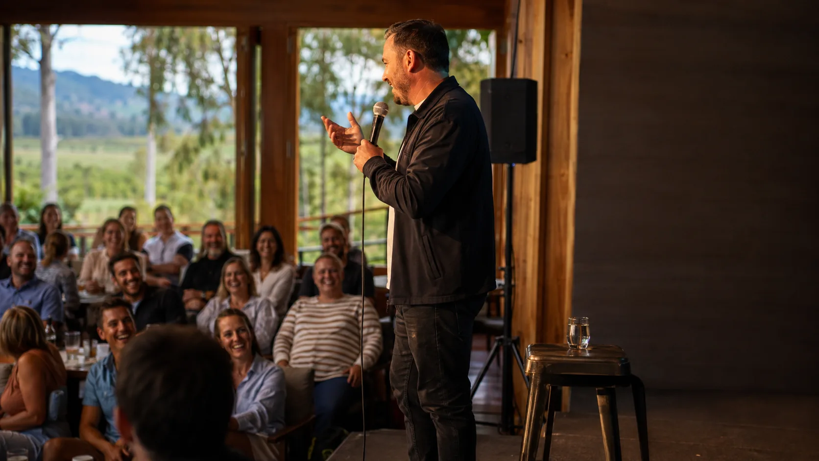 Comedian or MC engaging a seated event audience live in New Zealand